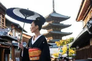 Asian woman with kimono walking at Yasaka Pagoda in Kyoto