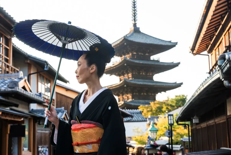 Asian woman with kimono walking at Yasaka Pagoda in Kyoto